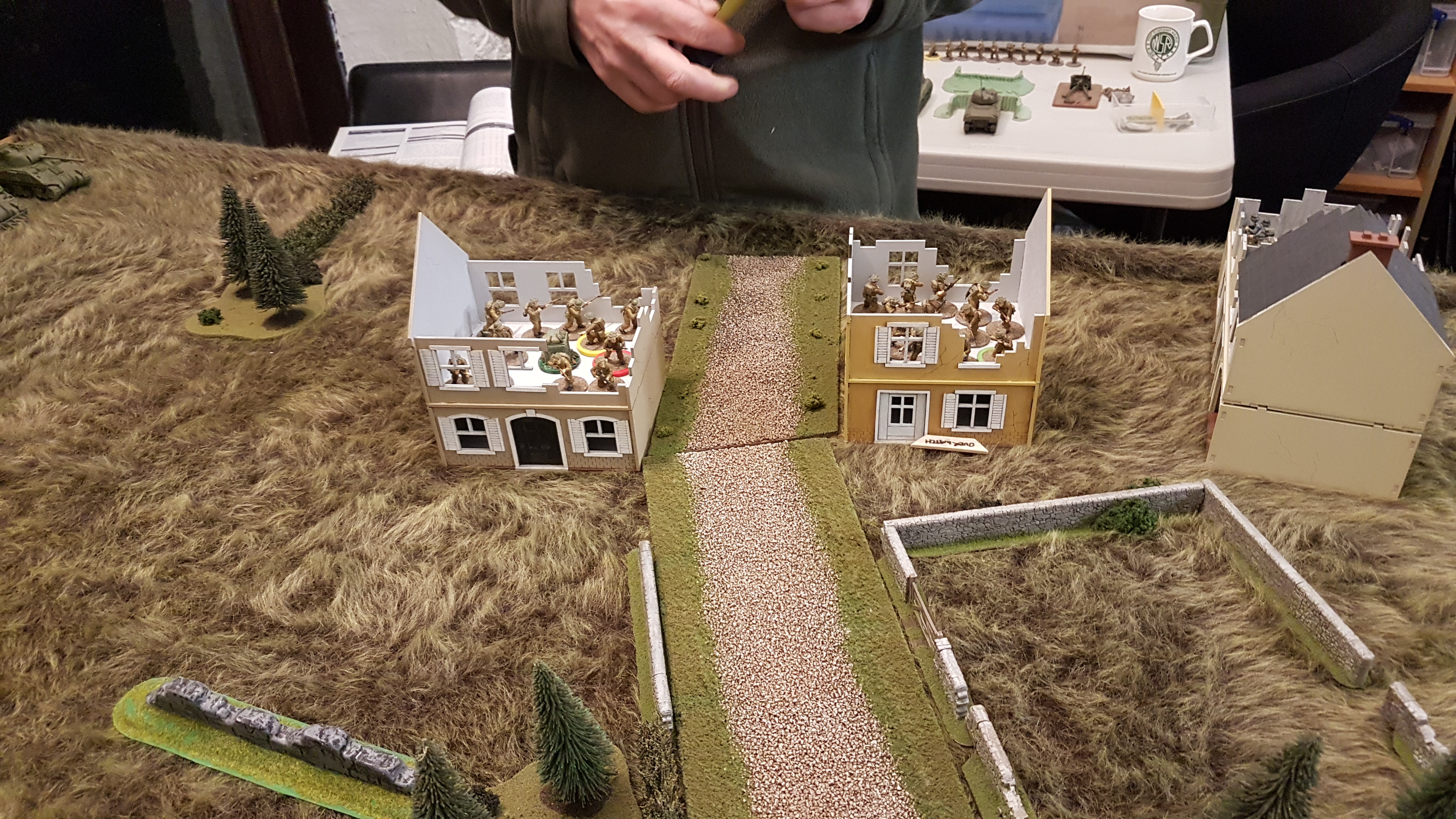 British Infantry secure tow of the buildings.