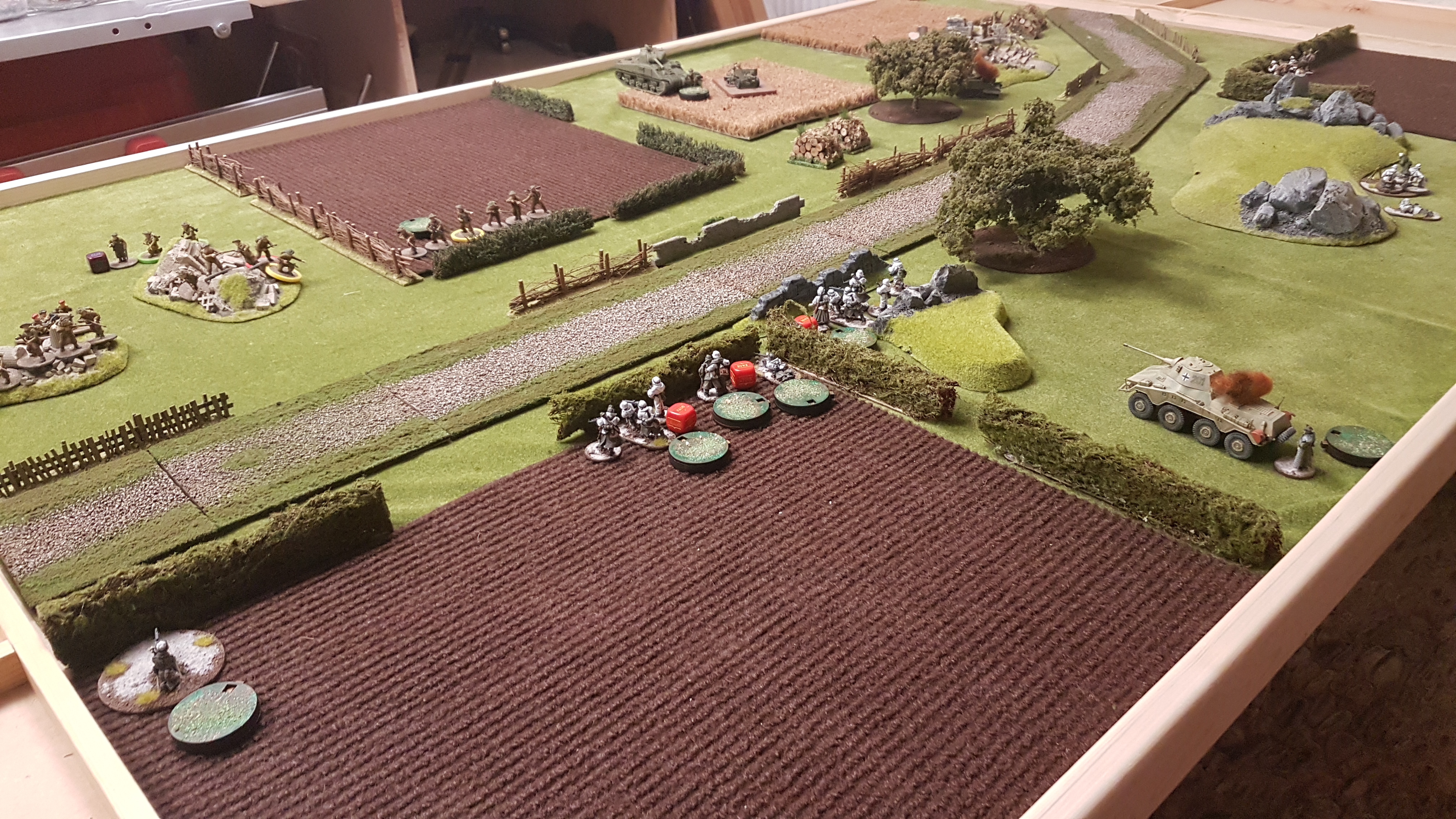 The German infantry and MMG team on the left flank take casualties and multiple pins from the British off table artillery bombardment.  Meanwhile the Puma and the Sherman exchange fire resulting in the Sherman having it's turret jammed (twice) and the Puma being knocked out.
