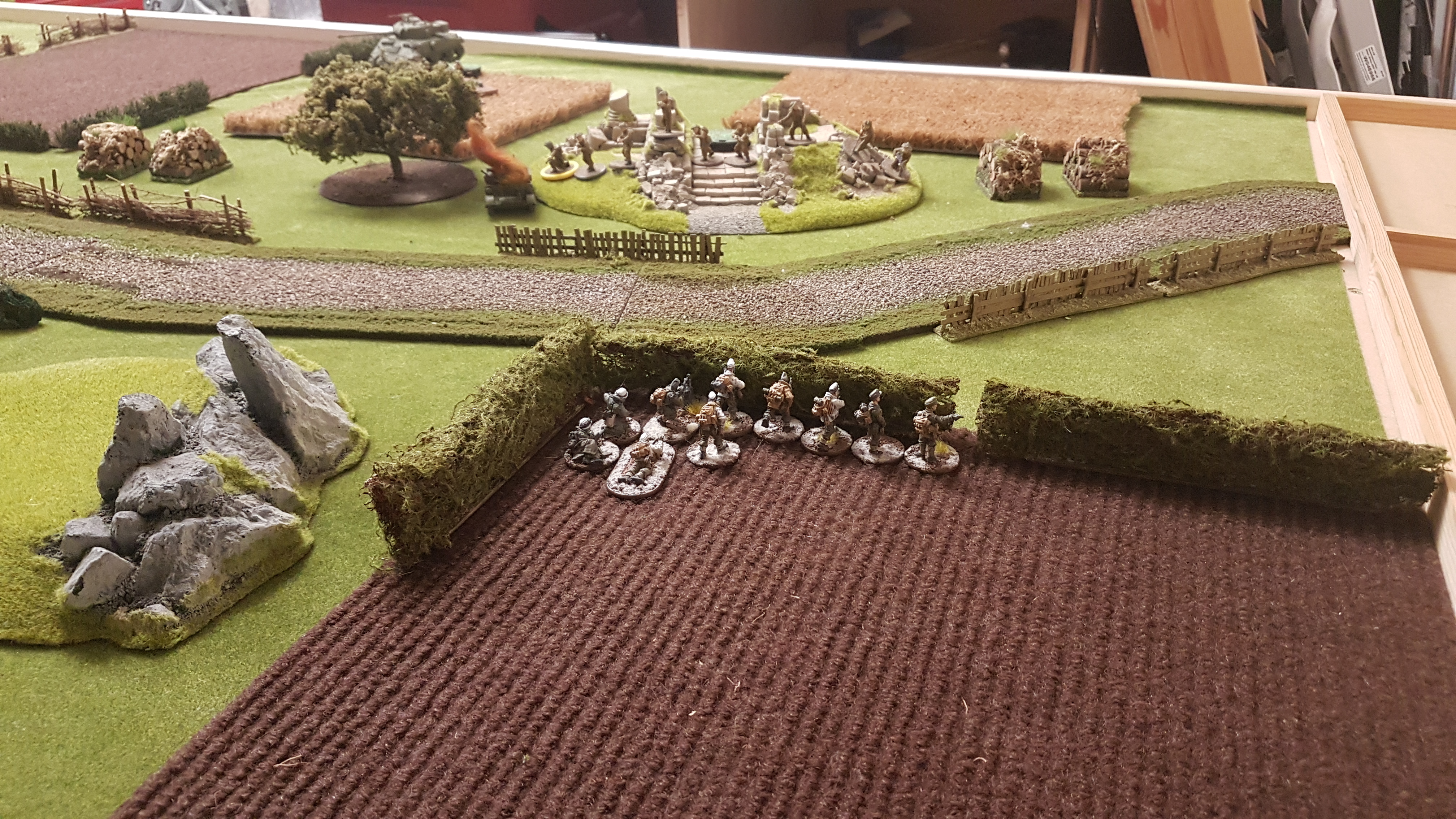 The German right is held by the German mountain troops and a flame thrower team.  The German artillery bombardment takes out the British Universal Carrier and cause pins on the infantry.