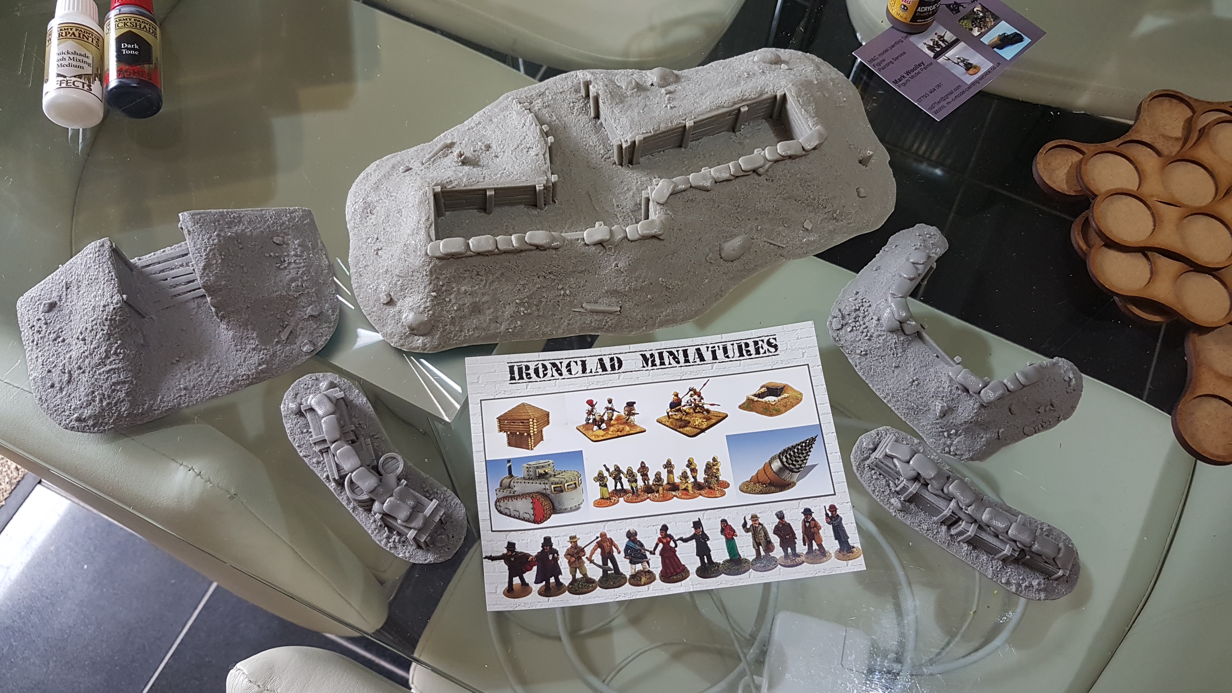Ironclad Miniatures produce some lovely resin scenics including trench system etc.  Not all items show as they'd run out of some at the show but promised to send them postage free.